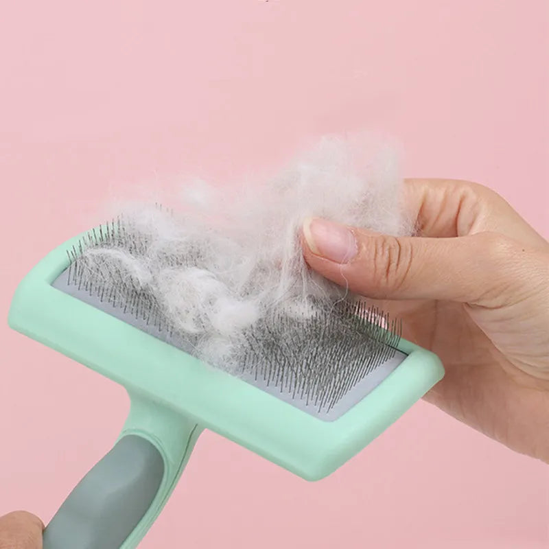 Dog Grooming Brush: Stainless steel, massage comb, removes pet hair efficiently.